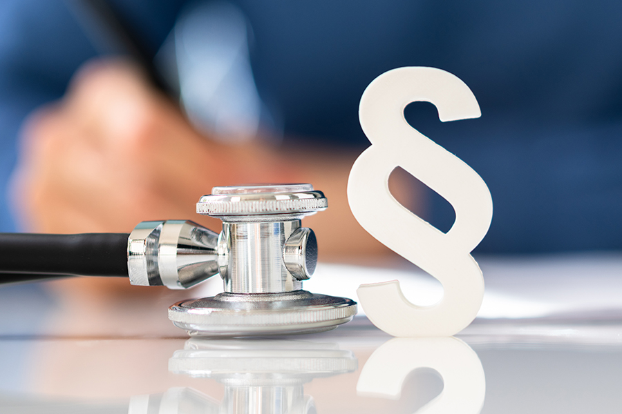 Medical Doctor Malpractice. Paragraph And Stethoscope